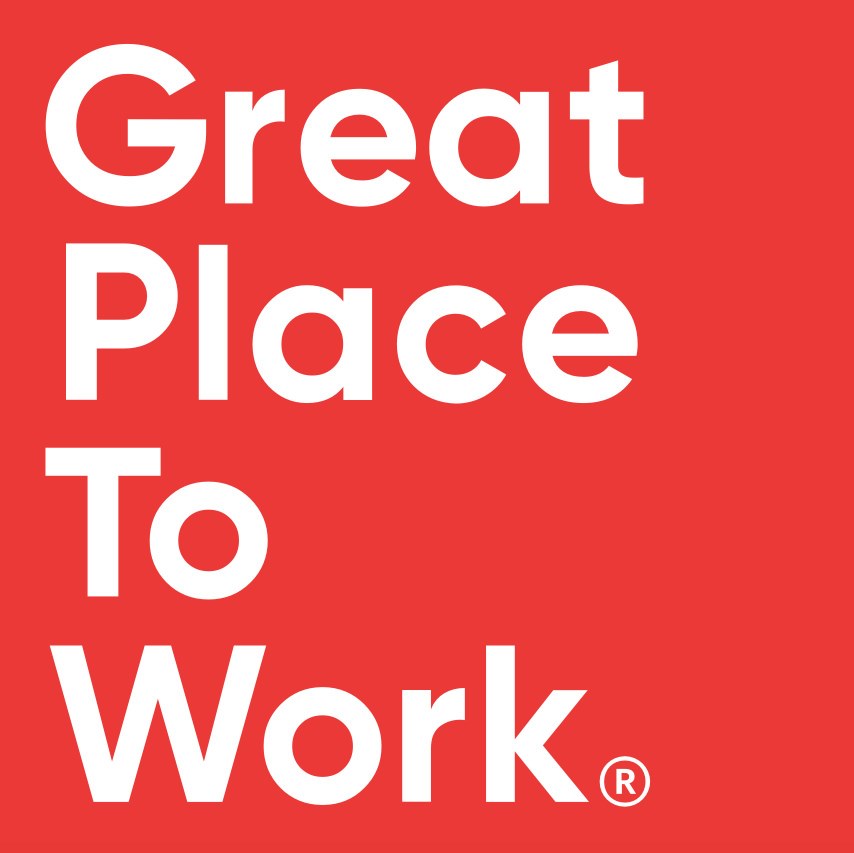 Red background with white text saying "Great Place To Work" and a registered trademark symbol.